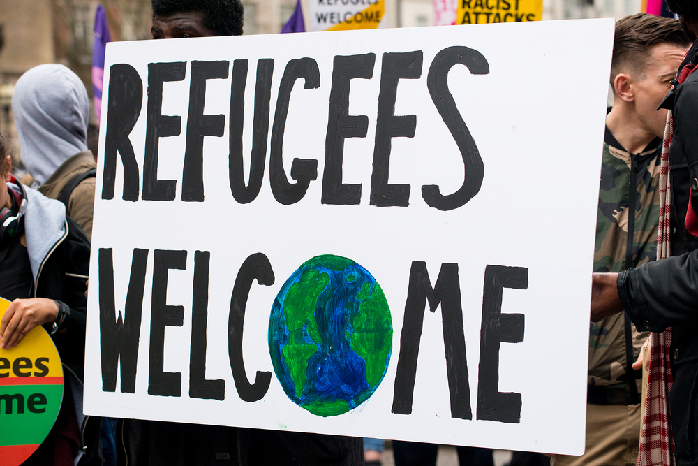 A sign displaying the words refugees welcome