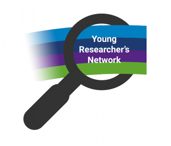 The Young Researcher’s Network logo, which is a black magnifying glass. Through the hole where the glass would be is a banner with stripes in the following colours, top to bottom: pale blue, dark blue, purple, green. The text ‘Young Researcher’s Network’ is on the banner.