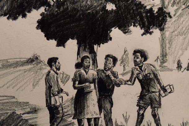 Four people standing under a tree and engaging in conversation.