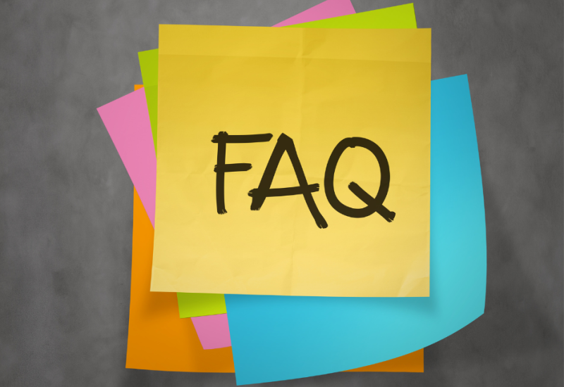'FAQ' text on a sticky note paper.