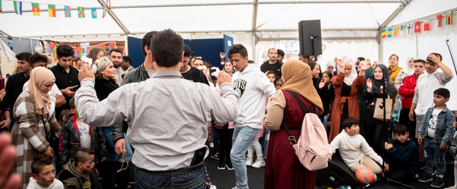 Crowds getting involved in the global village at the Yorkshire Integration Festival 2022